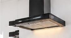 Chimney Care India technician mounting kitchen chimney on wall with level